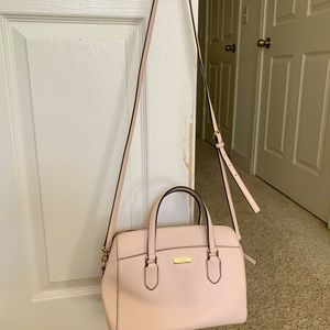 Light pink Kate spade crossbody bag with strap